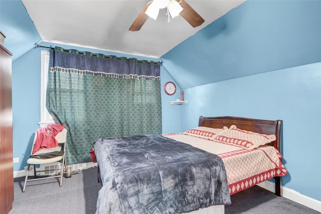 carpeted bedroom with lofted ceiling, baseboards, and ceiling fan