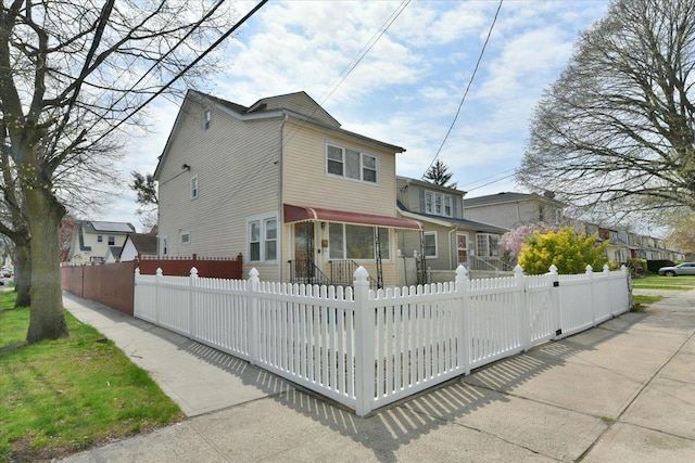 224-40 Fairbury Ave, Queens Village, NY 11428 - rear view of property with a fenced front yard