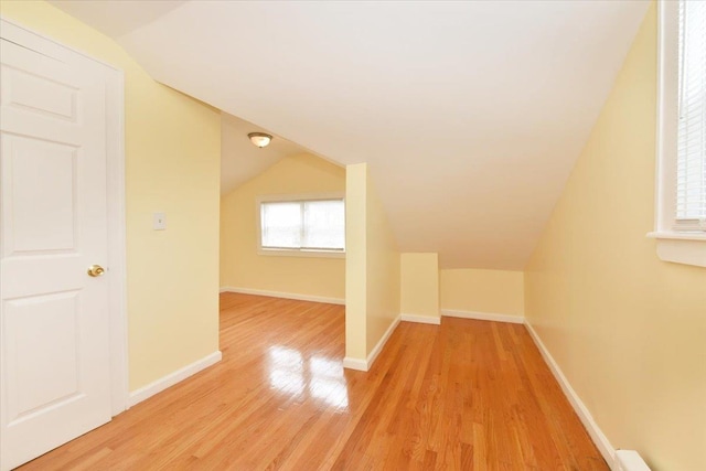 224-40 Fairbury Ave, Queens Village, NY 11428 - bonus room featuring light wood-style floors, vaulted ceiling, and baseboards