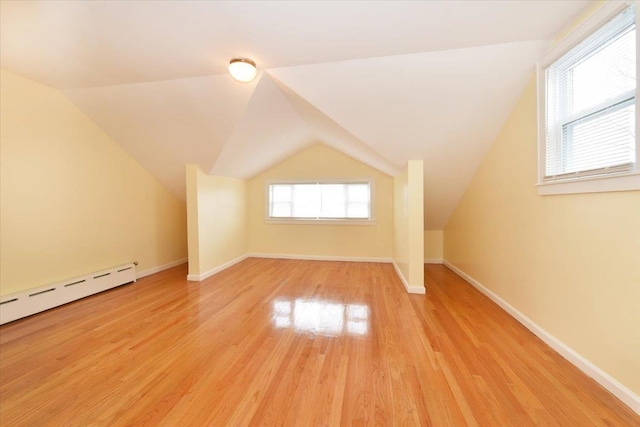 224-40 Fairbury Ave, Queens Village, NY 11428 - bonus room with lofted ceiling, baseboard heating, baseboards, and light wood-type flooring