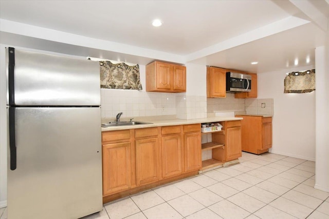 224-40 Fairbury Ave, Queens Village, NY 11428 - kitchen with tasteful backsplash, a sink, light tile patterned floors, light countertops, and appliances with stainless steel finishes