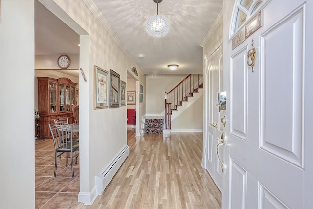 176 Kearsing Pkwy, Monsey, NY 10952 - entryway featuring baseboard heating, stairs, baseboards, ornamental molding, and light wood-style floors