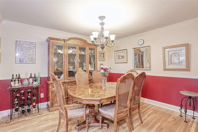 176 Kearsing Pkwy, Monsey, NY 10952 - dining area with a chandelier, light wood finished floors, crown molding, and baseboards