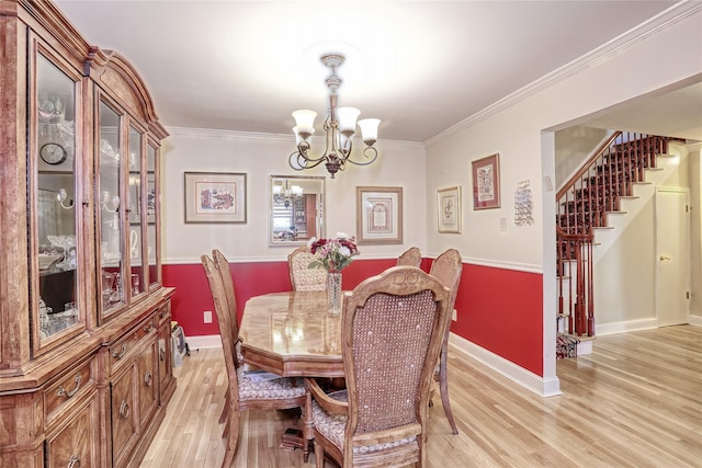 176 Kearsing Pkwy, Monsey, NY 10952 - dining area featuring a chandelier, stairway, light wood-style flooring, baseboards, and ornamental molding