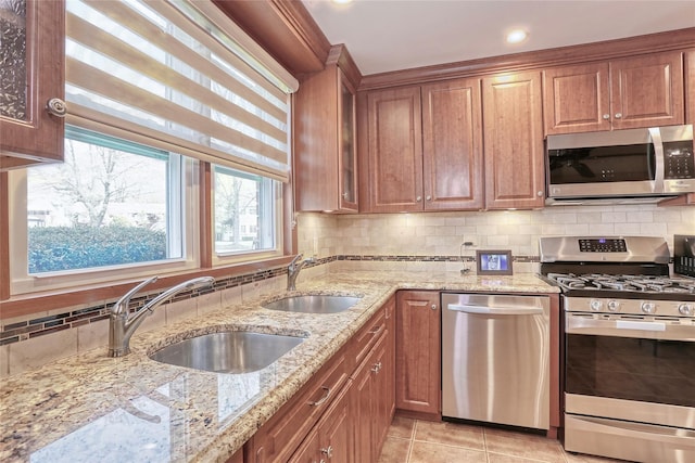 176 Kearsing Pkwy, Monsey, NY 10952 - kitchen with stainless steel appliances, a sink, and brown cabinets