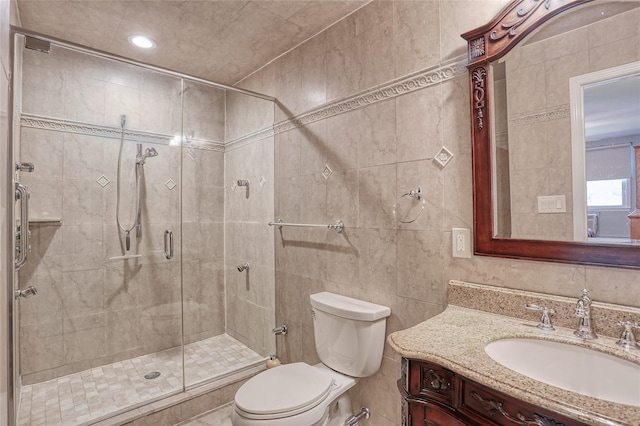 176 Kearsing Pkwy, Monsey, NY 10952 - full bathroom with tile walls, toilet, vanity, a stall shower, and recessed lighting