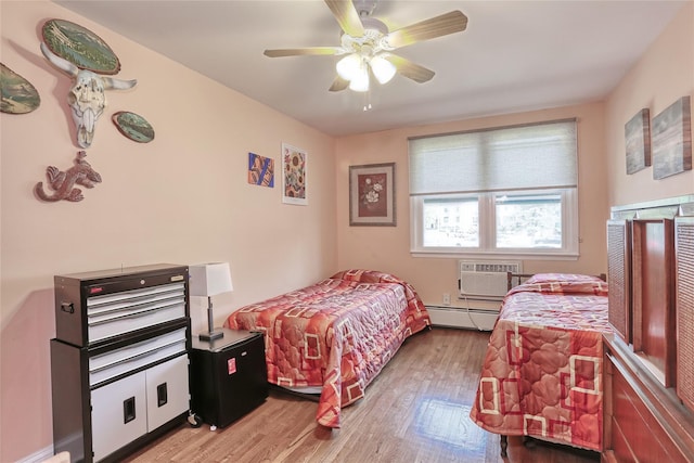 176 Kearsing Pkwy, Monsey, NY 10952 - bedroom with a wall unit AC, light wood-style floors, a baseboard heating unit, and a ceiling fan