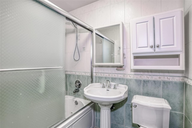 176 Kearsing Pkwy, Monsey, NY 10952 - full bathroom featuring toilet, enclosed tub / shower combo, and tile walls