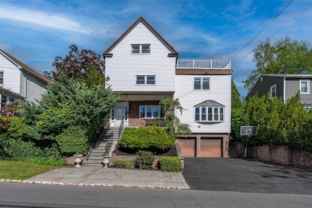 116 Oakland Ave, Tuckahoe, NY 10707 - view of front of home featuring stairway, a garage, asphalt driveway, and brick siding
