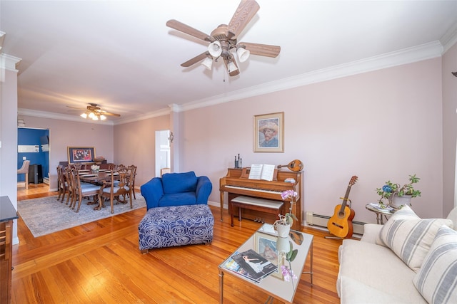 116 Oakland Ave, Tuckahoe, NY 10707 - living room featuring a ceiling fan, crown molding, light wood-style floors, and baseboards