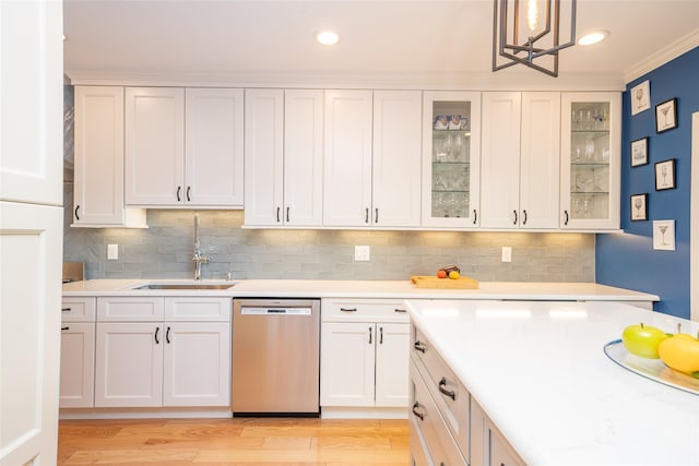 116 Oakland Ave, Tuckahoe, NY 10707 - kitchen featuring stainless steel dishwasher, a sink, light countertops, white cabinetry, and recessed lighting