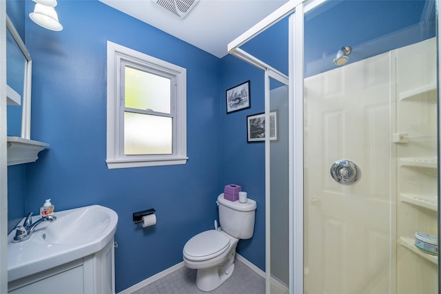 116 Oakland Ave, Tuckahoe, NY 10707 - bathroom featuring a stall shower, toilet, vanity, baseboards, and tile patterned floors