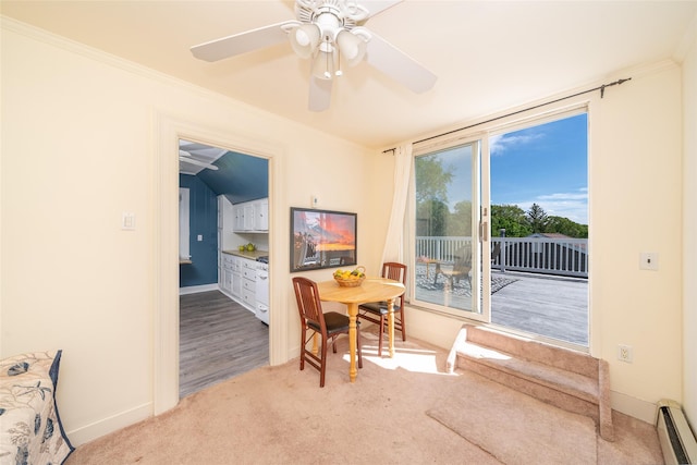 116 Oakland Ave, Tuckahoe, NY 10707 - carpeted dining space with a baseboard heating unit, a ceiling fan, ornamental molding, and baseboards