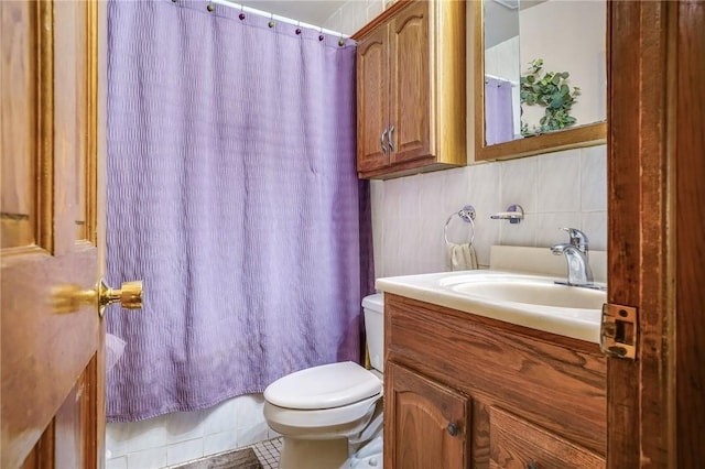 full bath with toilet and vanity