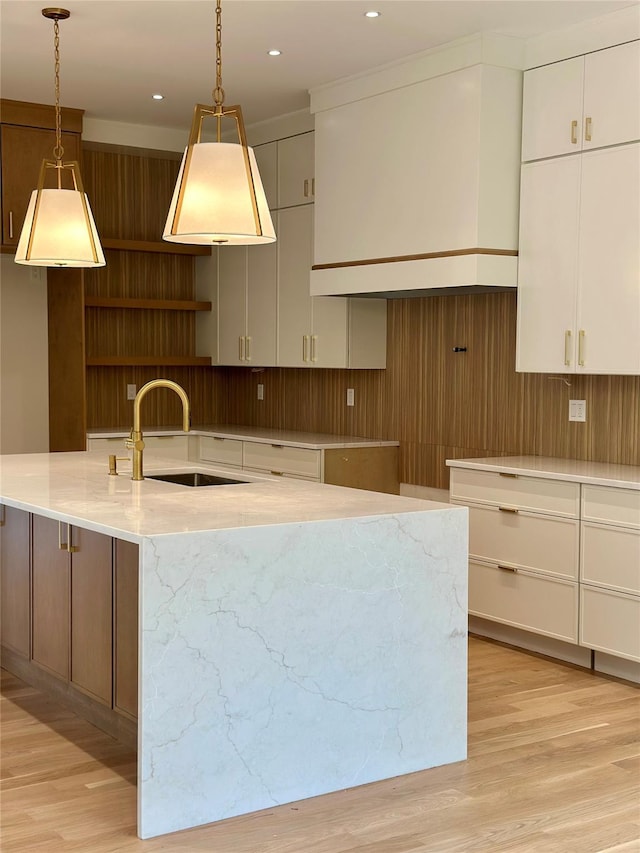 9 Ogrady Ct, Orangeburg, NY 10962 - kitchen featuring a sink, light wood-style flooring, decorative light fixtures, recessed lighting, and white cabinets