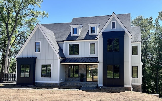 9 Ogrady Ct, Orangeburg, NY 10962 - modern farmhouse with a standing seam roof, a shingled roof, metal roof, a porch, and board and batten siding