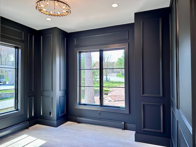 9 Ogrady Ct, Orangeburg, NY 10962 - foyer entrance with baseboard heating, a decorative wall, recessed lighting, a chandelier, and light wood-style flooring