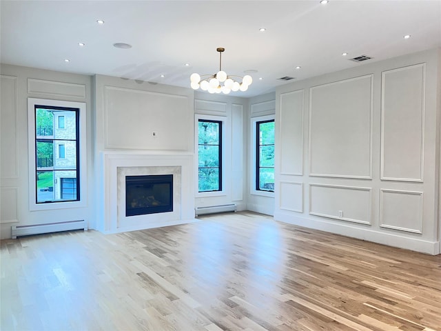 9 Ogrady Ct, Orangeburg, NY 10962 - unfurnished living room featuring a decorative wall, baseboard heating, a chandelier, light wood finished floors, and recessed lighting