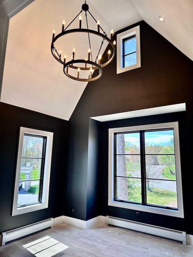 9 Ogrady Ct, Orangeburg, NY 10962 - detailed view of a baseboard heating unit, a chandelier, wood finished floors, and baseboards