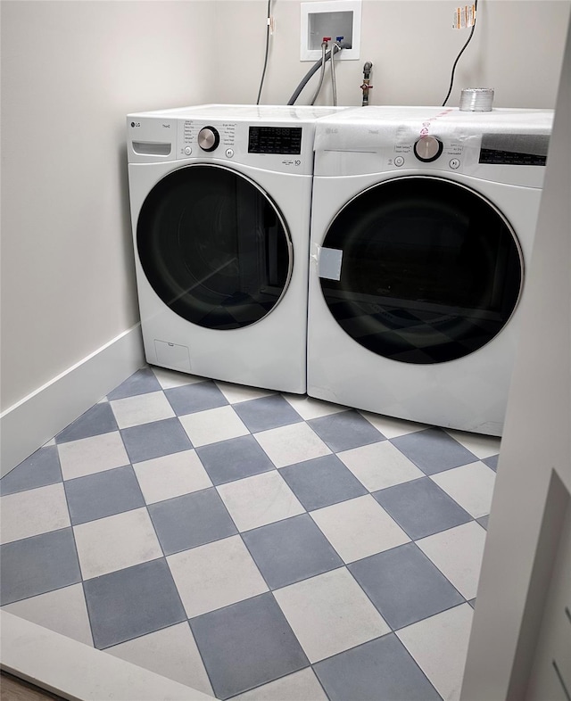 9 Ogrady Ct, Orangeburg, NY 10962 - laundry area with washing machine and clothes dryer, baseboards, and tile patterned floors