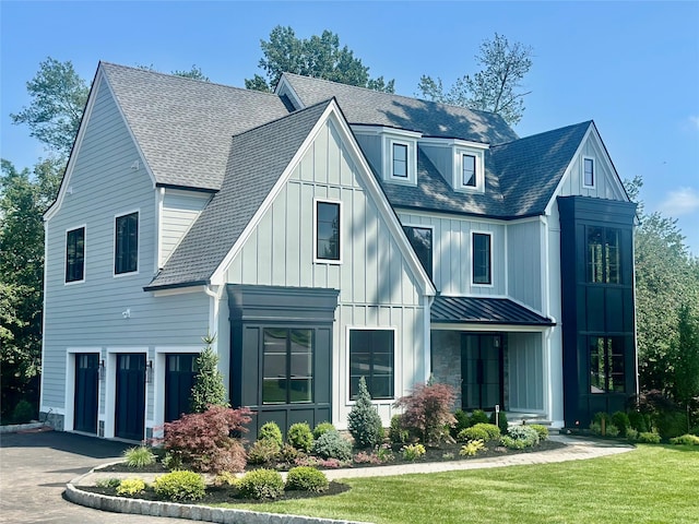9 Ogrady Ct, Orangeburg, NY 10962 - modern farmhouse with a garage, a standing seam roof, board and batten siding, asphalt driveway, and a shingled roof