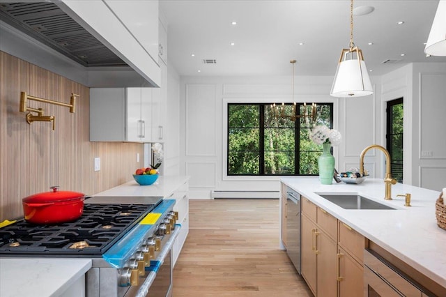 9 Ogrady Ct, Orangeburg, NY 10962 - kitchen featuring stainless steel appliances, a baseboard radiator, healthy amount of natural light, ventilation hood, and recessed lighting