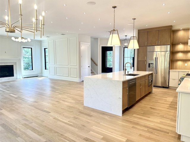 9 Ogrady Ct, Orangeburg, NY 10962 - kitchen featuring appliances with stainless steel finishes, open floor plan, light wood finished floors, healthy amount of natural light, and recessed lighting