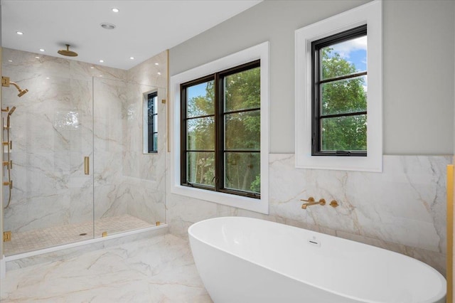 9 Ogrady Ct, Orangeburg, NY 10962 - bathroom featuring a marble finish shower, healthy amount of natural light, a freestanding tub, marble tiled flooring, and tile walls