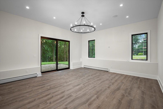 9 Ogrady Ct, Orangeburg, NY 10962 - unfurnished room featuring baseboard heating, plenty of natural light, wood finished floors, a chandelier, and recessed lighting