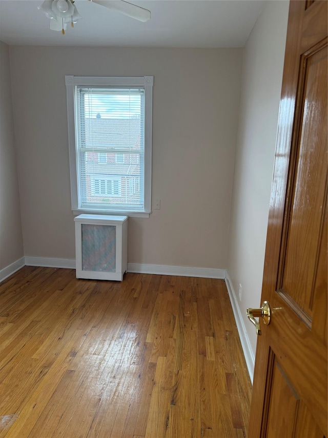 93-30 246th St, Bellerose Terrace, NY 11001 - spare room with baseboards, a ceiling fan, and light wood-type flooring