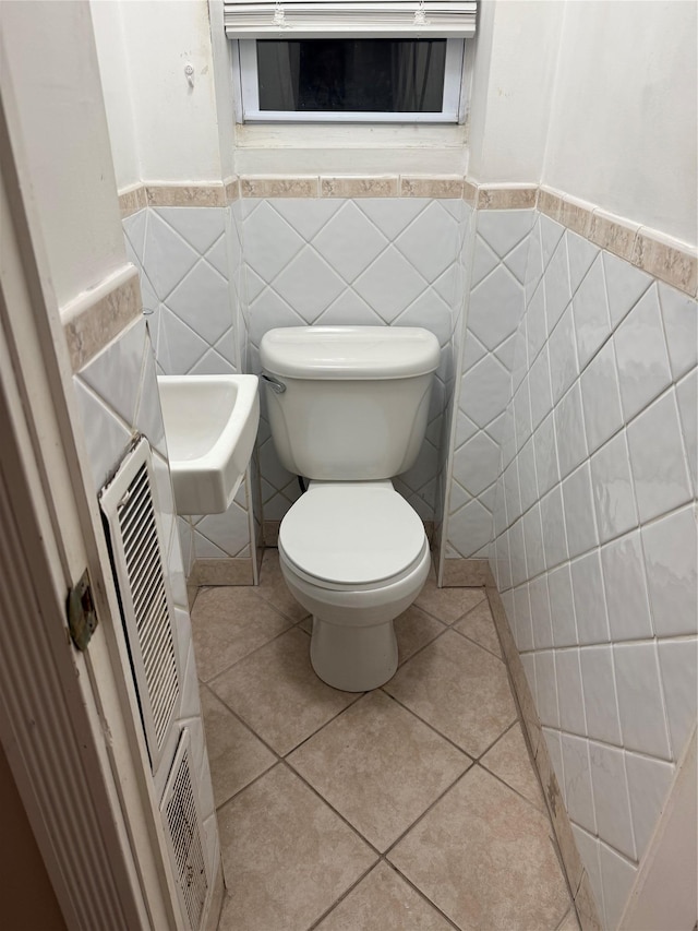 93-30 246th St, Bellerose Terrace, NY 11001 - bathroom with tile patterned flooring, toilet, a wainscoted wall, and tile walls