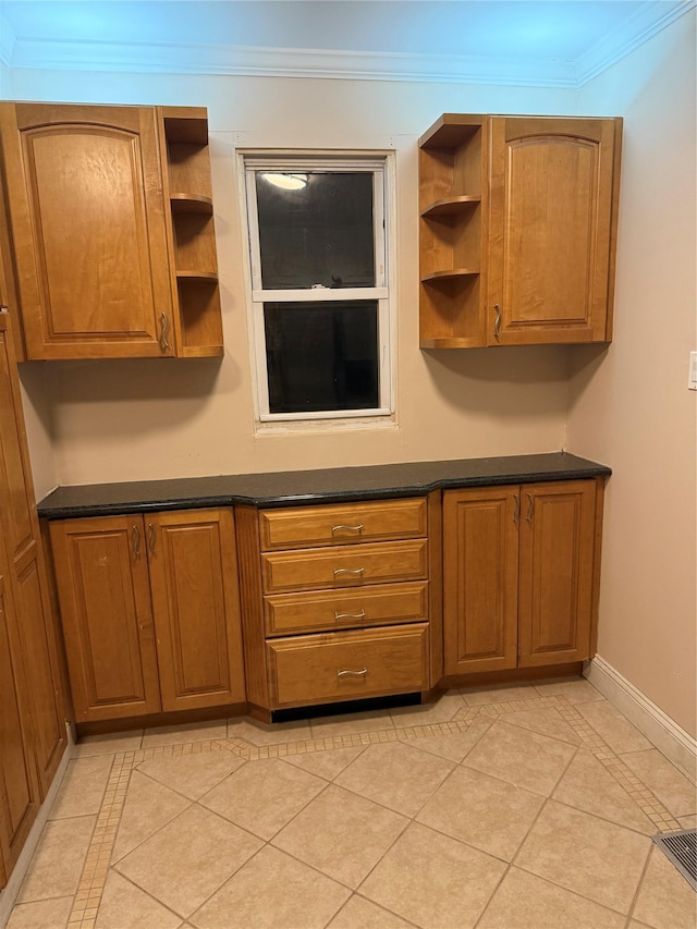 93-30 246th St, Bellerose Terrace, NY 11001 - kitchen with dark countertops, open shelves, crown molding, brown cabinets, and baseboards