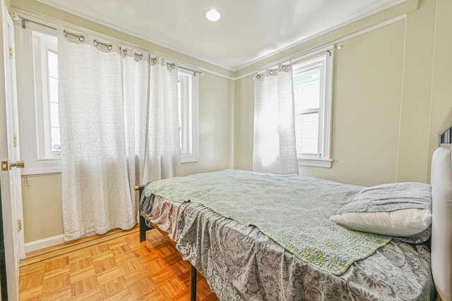 bedroom featuring baseboards, ornamental molding, and recessed lighting