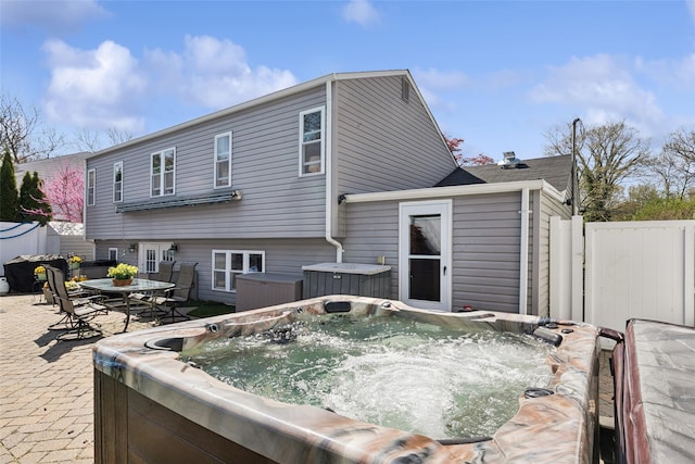 21 Via Continental, Huntington Station, NY 11746 - back of property featuring fence, a patio, and a hot tub