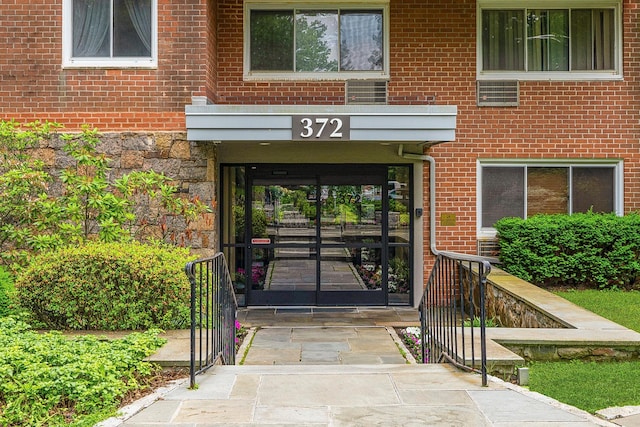 372 Central Park Ave Unit 1C, Scarsdale, NY 10583 - property entrance with brick siding, french doors, and stone siding