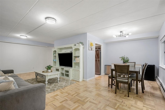 372 Central Park Ave Unit 1C, Scarsdale, NY 10583 - living area with a baseboard heating unit and a chandelier