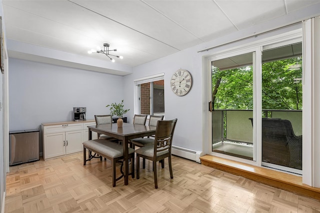 372 Central Park Ave Unit 1C, Scarsdale, NY 10583 - dining room featuring a baseboard radiator and a chandelier