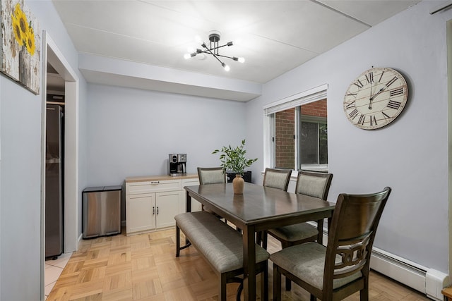 372 Central Park Ave Unit 1C, Scarsdale, NY 10583 - dining space with baseboard heating and a chandelier