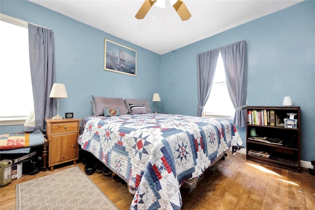bedroom featuring hardwood / wood-style floors and ceiling fan