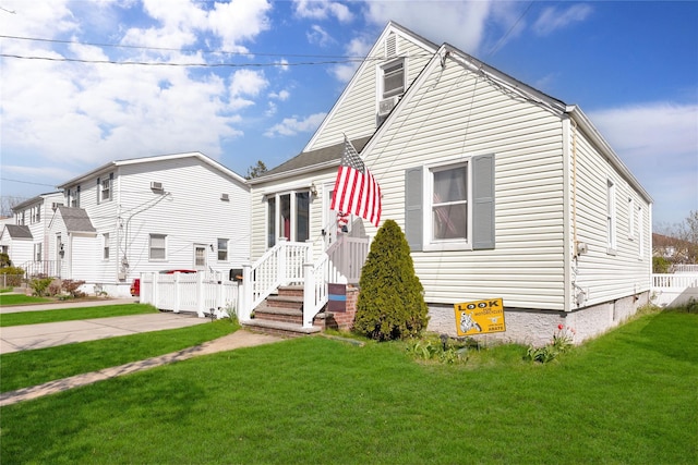 bungalow-style house with crawl space, fence, and a front yard