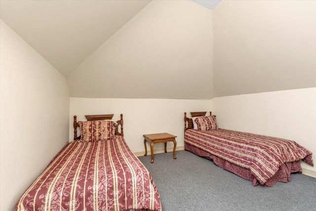 bedroom with carpet flooring and vaulted ceiling