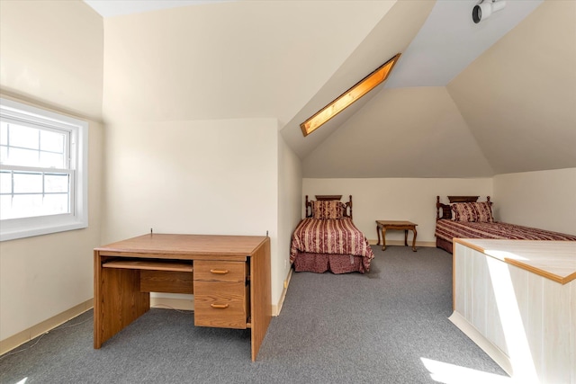 carpeted bedroom with lofted ceiling