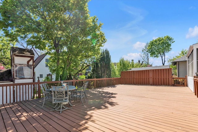 wooden terrace featuring outdoor dining space