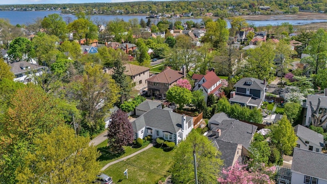 bird's eye view featuring a residential view and a water view