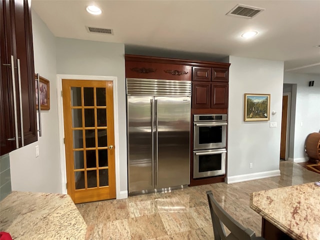 kitchen with baseboards, visible vents, recessed lighting, and appliances with stainless steel finishes