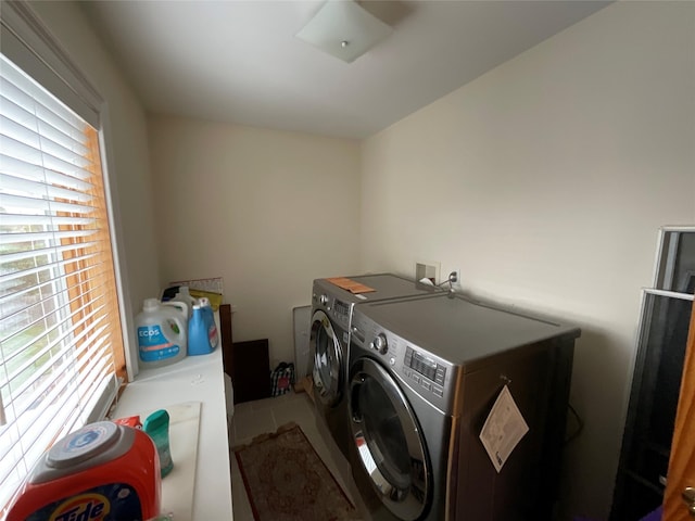 laundry room with washer and dryer and laundry area