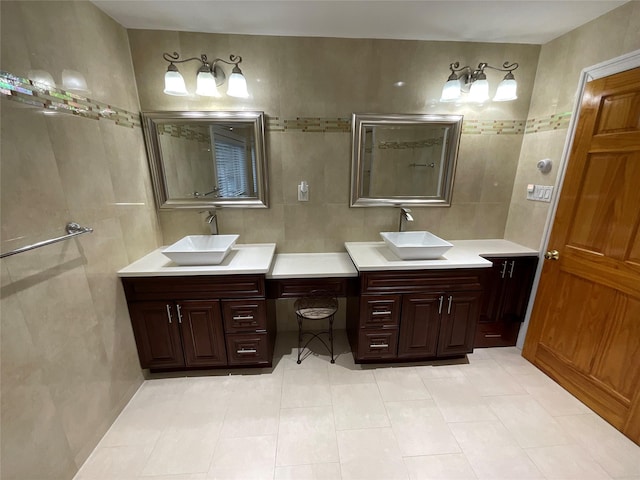 full bathroom with tile walls, tile patterned floors, and a sink