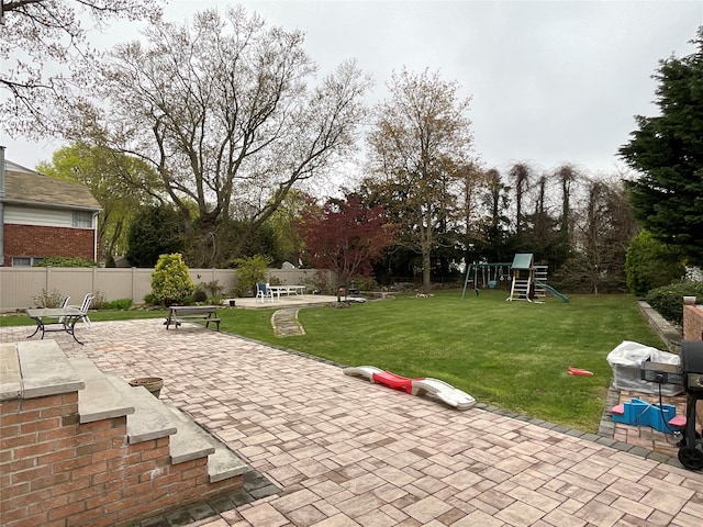 exterior space featuring fence and a playground