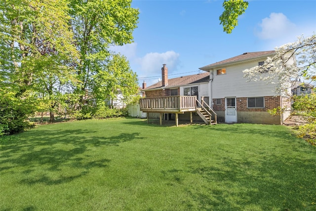 view of yard featuring a wooden deck and stairway
