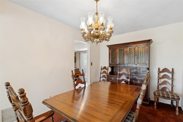 dining room featuring baseboards, a notable chandelier, and dark carpet